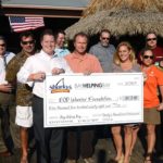 Check presentation to EOD Warrior Foundation from a Bay Helping Bay event