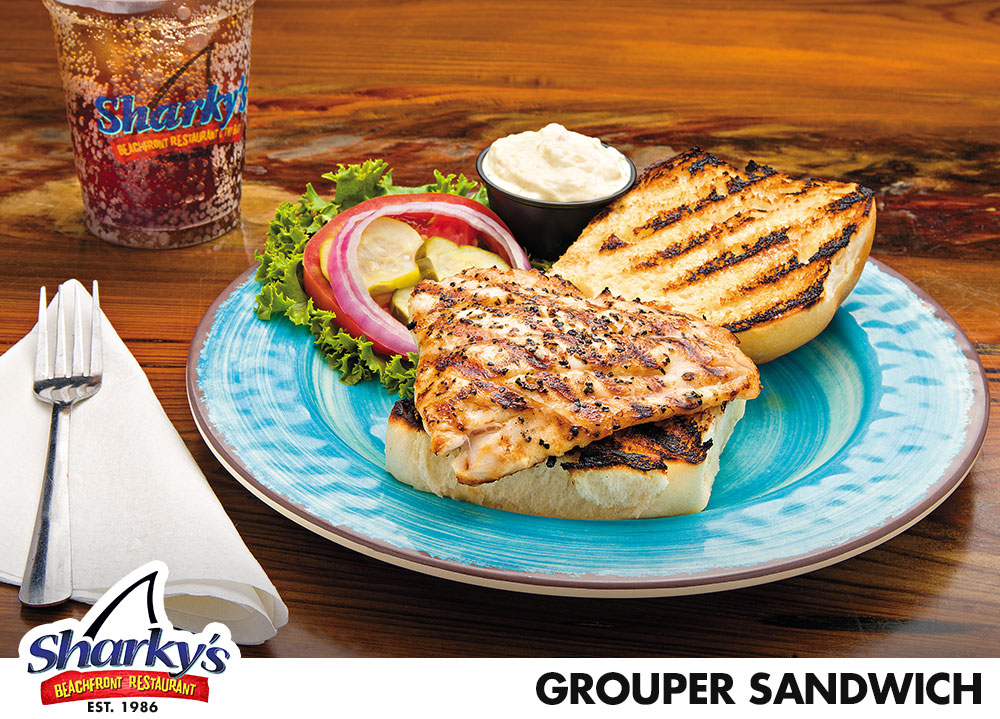 Grouper Sandwich is made with fried, grilled, or blackened Grouper filet served with Tartar sauce on the side along with lettuce, tomato, red onion slices & pickles
