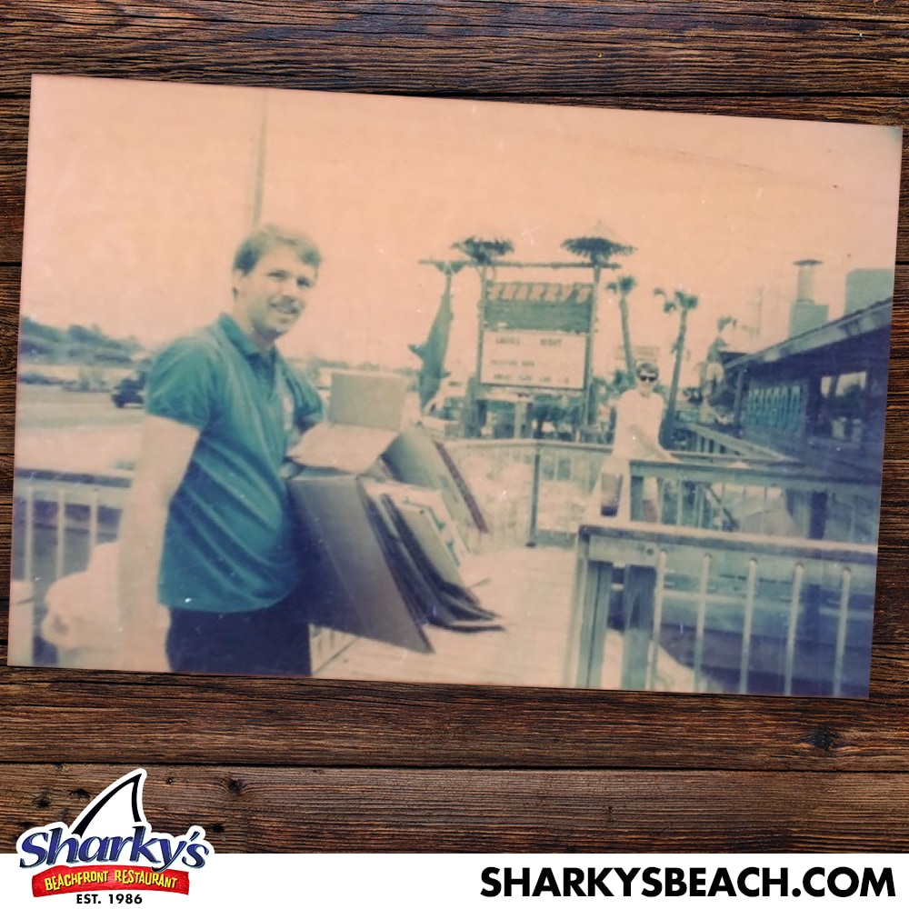 Guy in front of original Sharky's sign