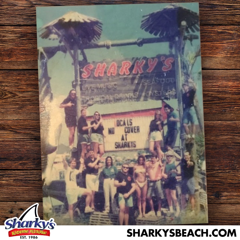 Sharky's opening team in front of the original Sharky's sign