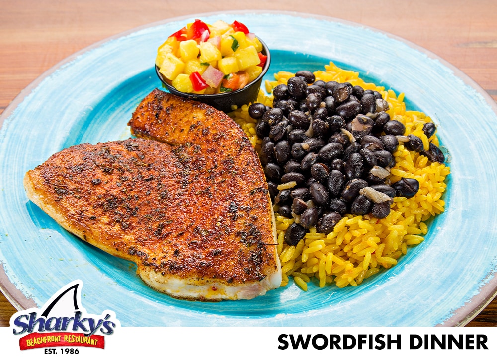 Swordfish Dinner made with Blackened or Grilled Swordfish served with Mango Salsa, Beurre Blanc or Pan-Asian Sauce.